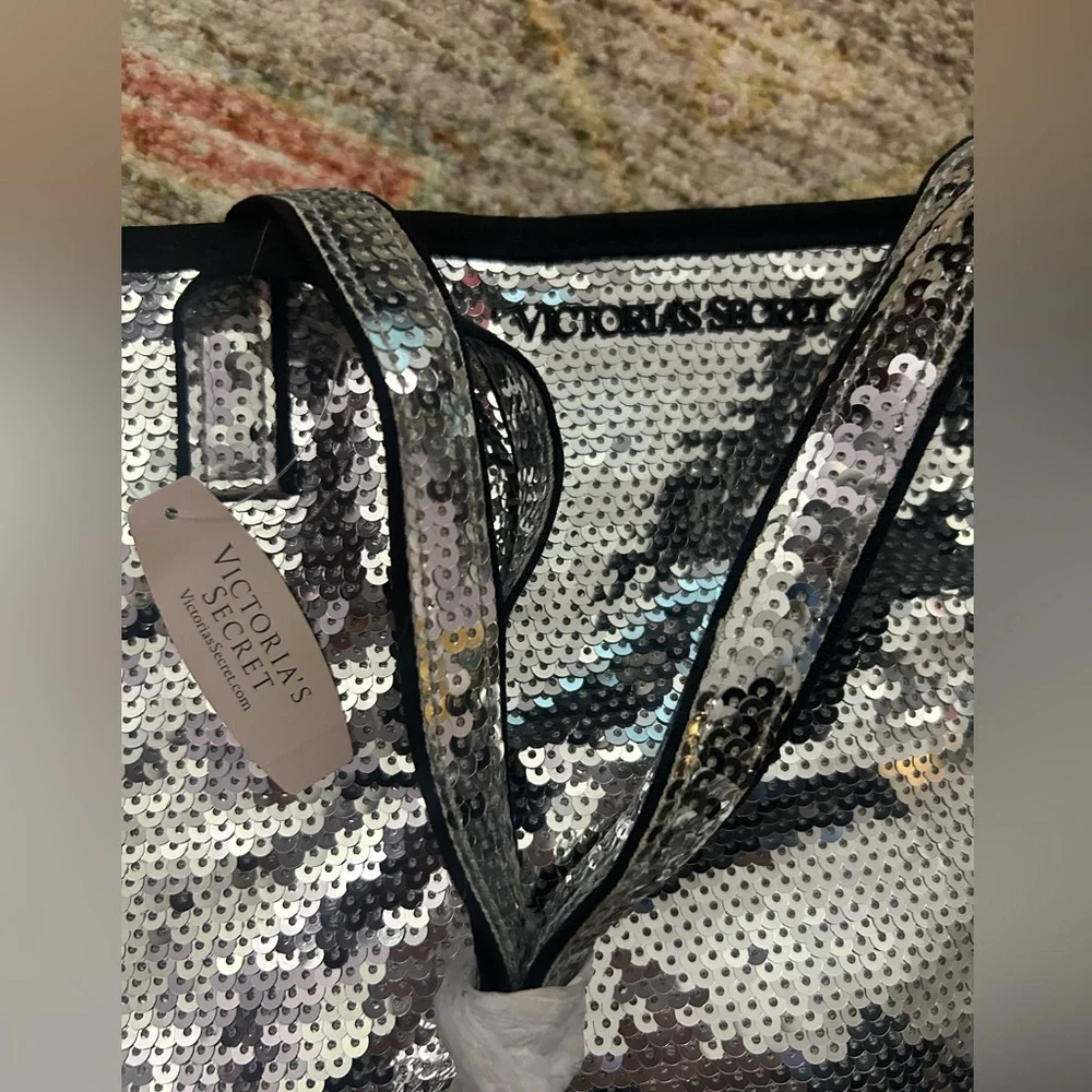 NWT - Silver sequin Victoria’s Secret bag.￼16 wide x 3.5 bottom.